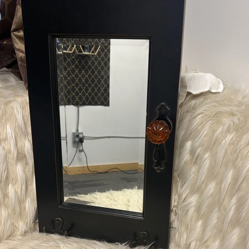 Elegant Black Mirror with Amber Detail